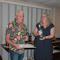 Jean collecting prize for most points in show